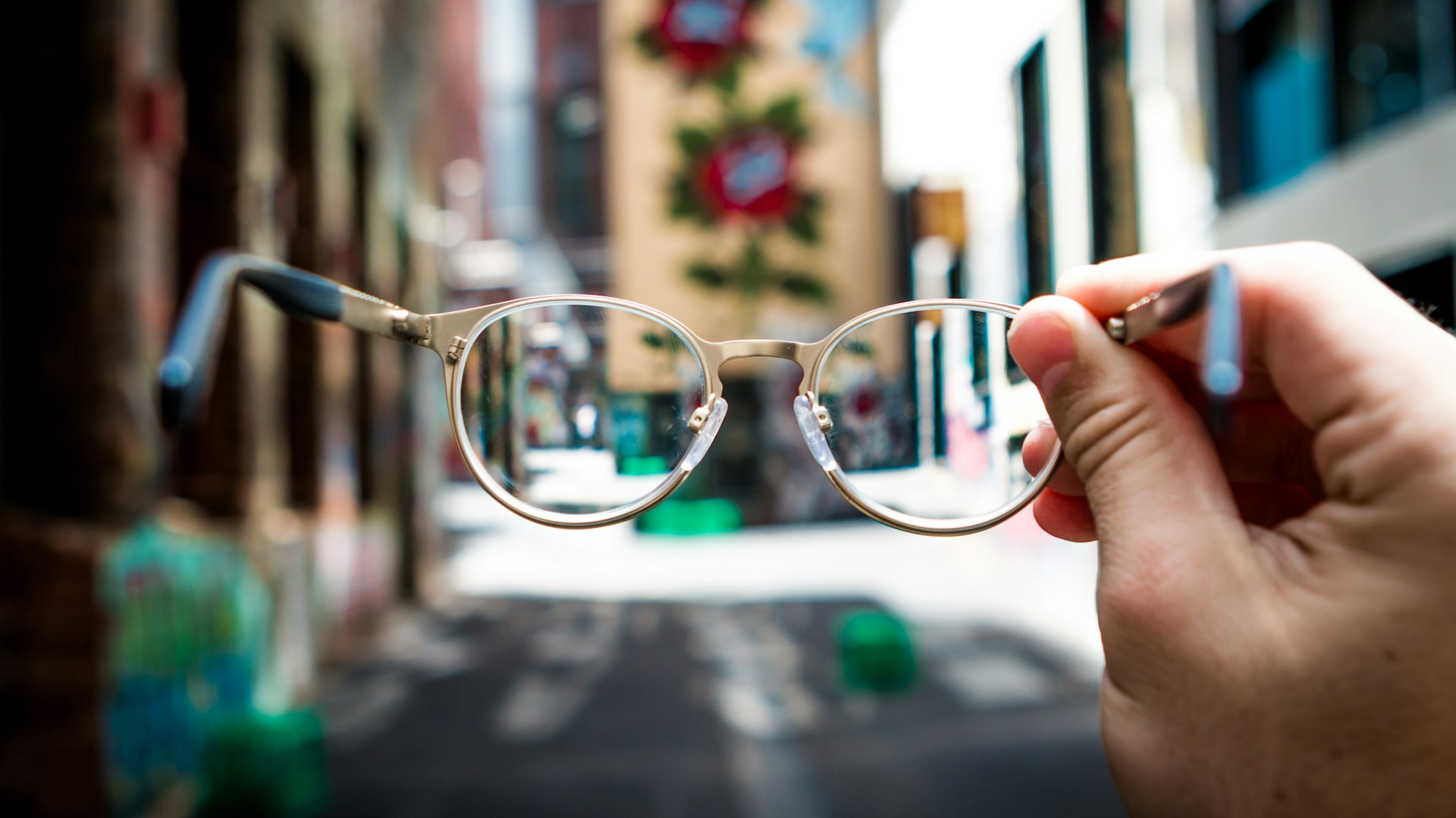 person holding eyeglasses