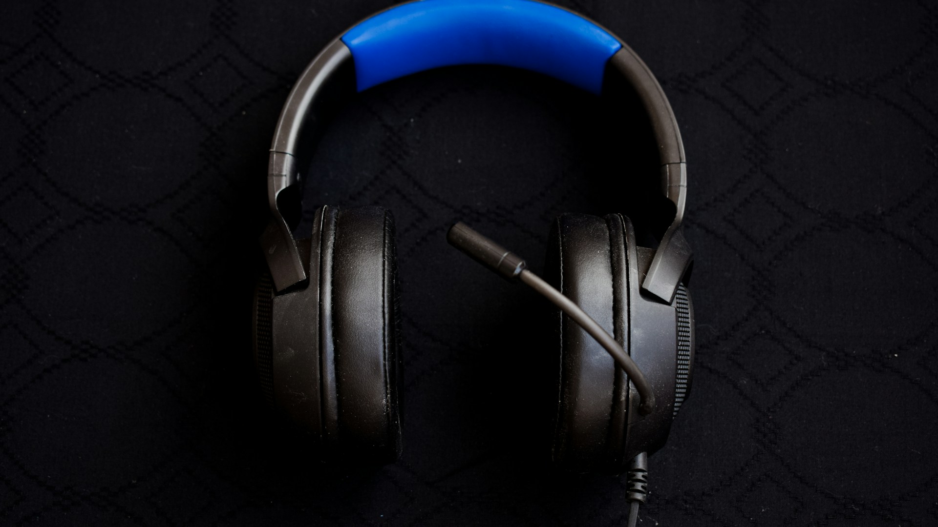 black and blue corded headphones