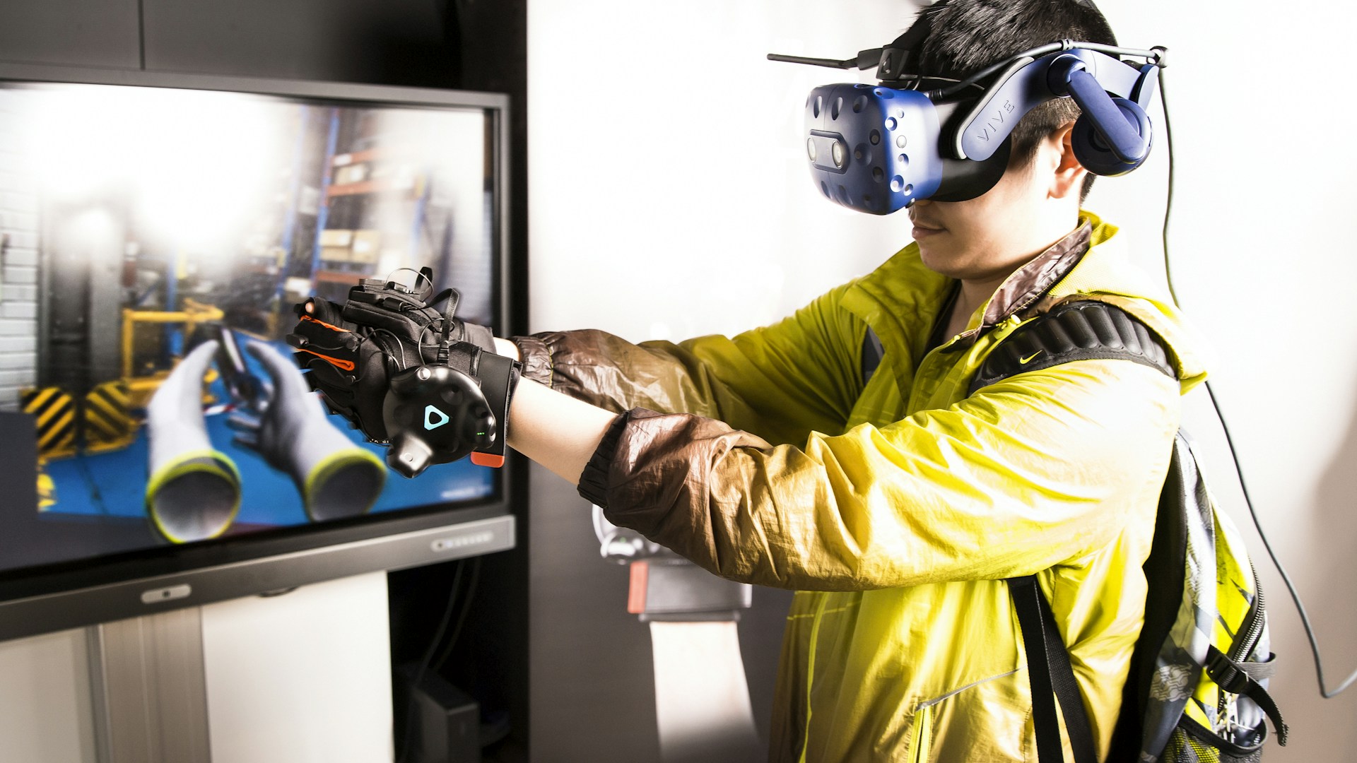 man in yellow jacket wearing black goggles