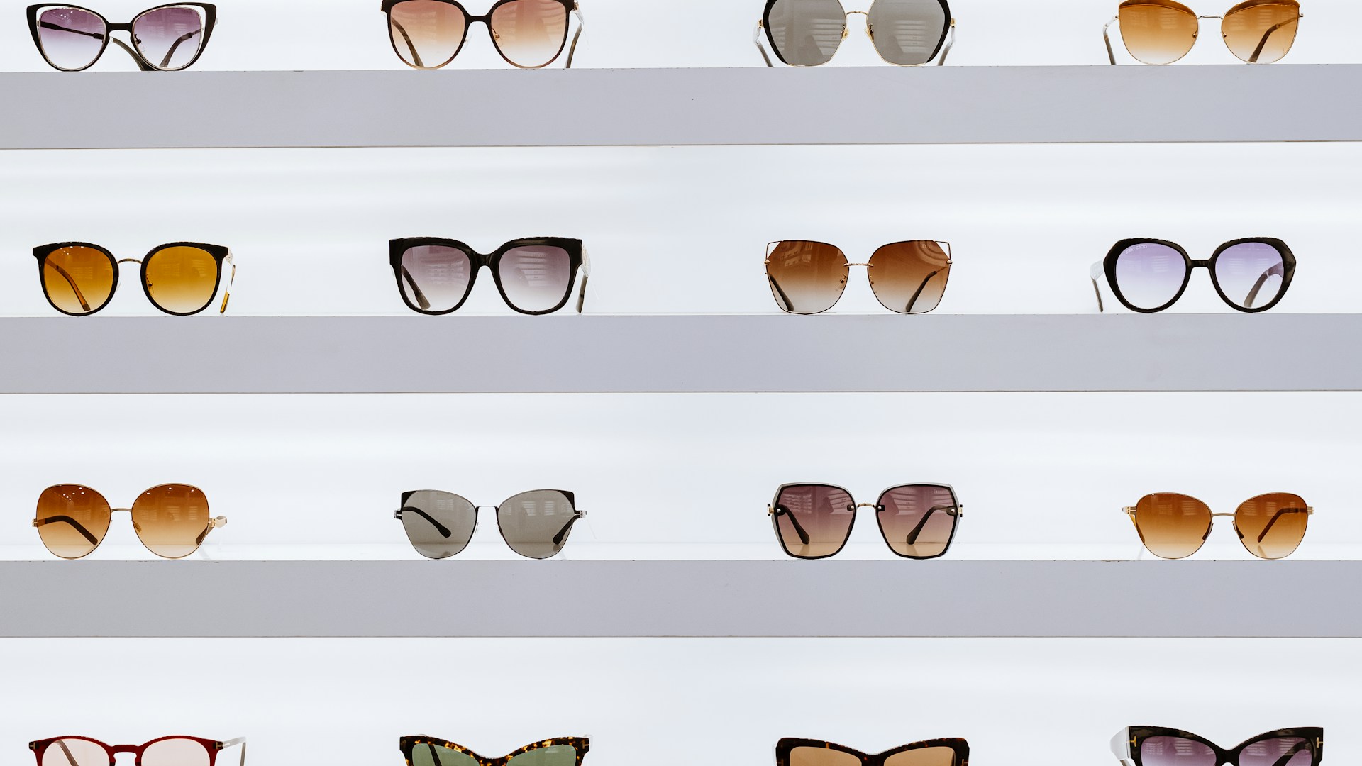 black framed sunglasses on white surface