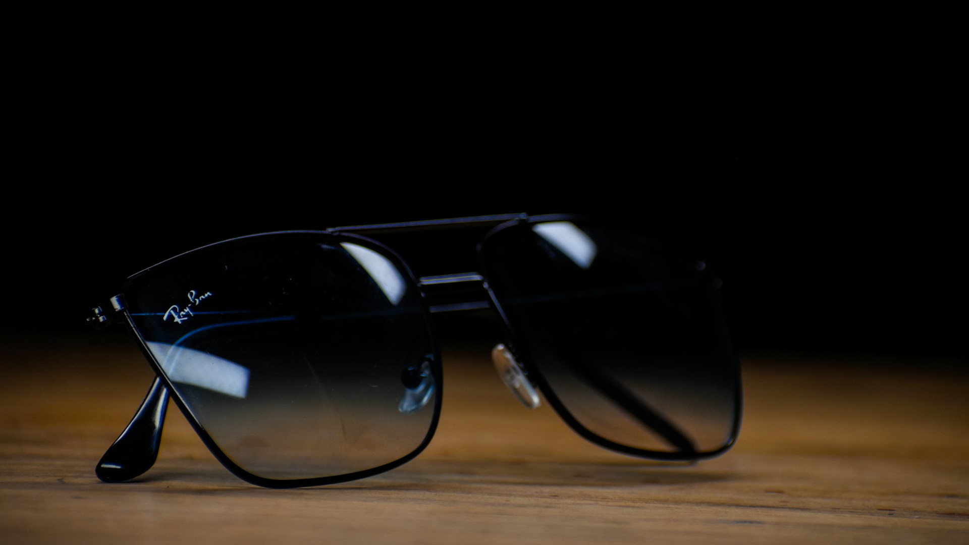 a pair of black sunglasses