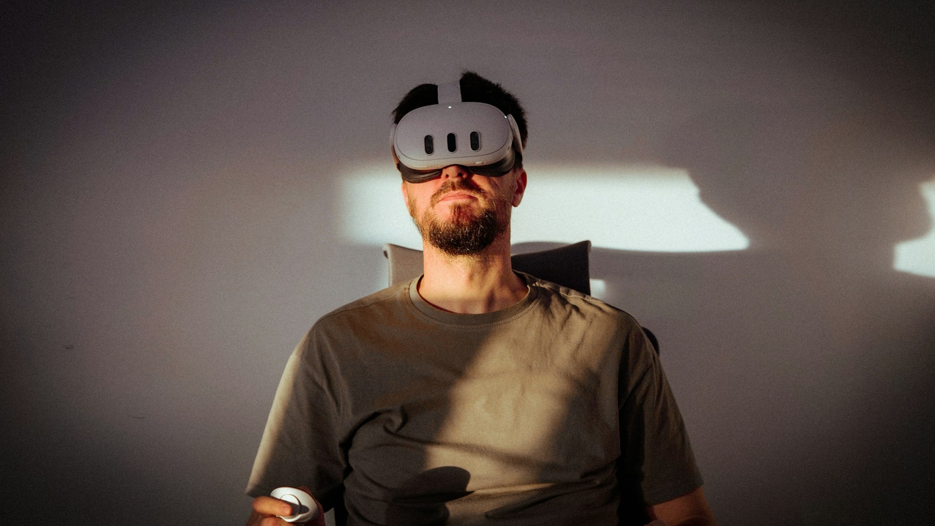 a man wearing a mask and holding a remote