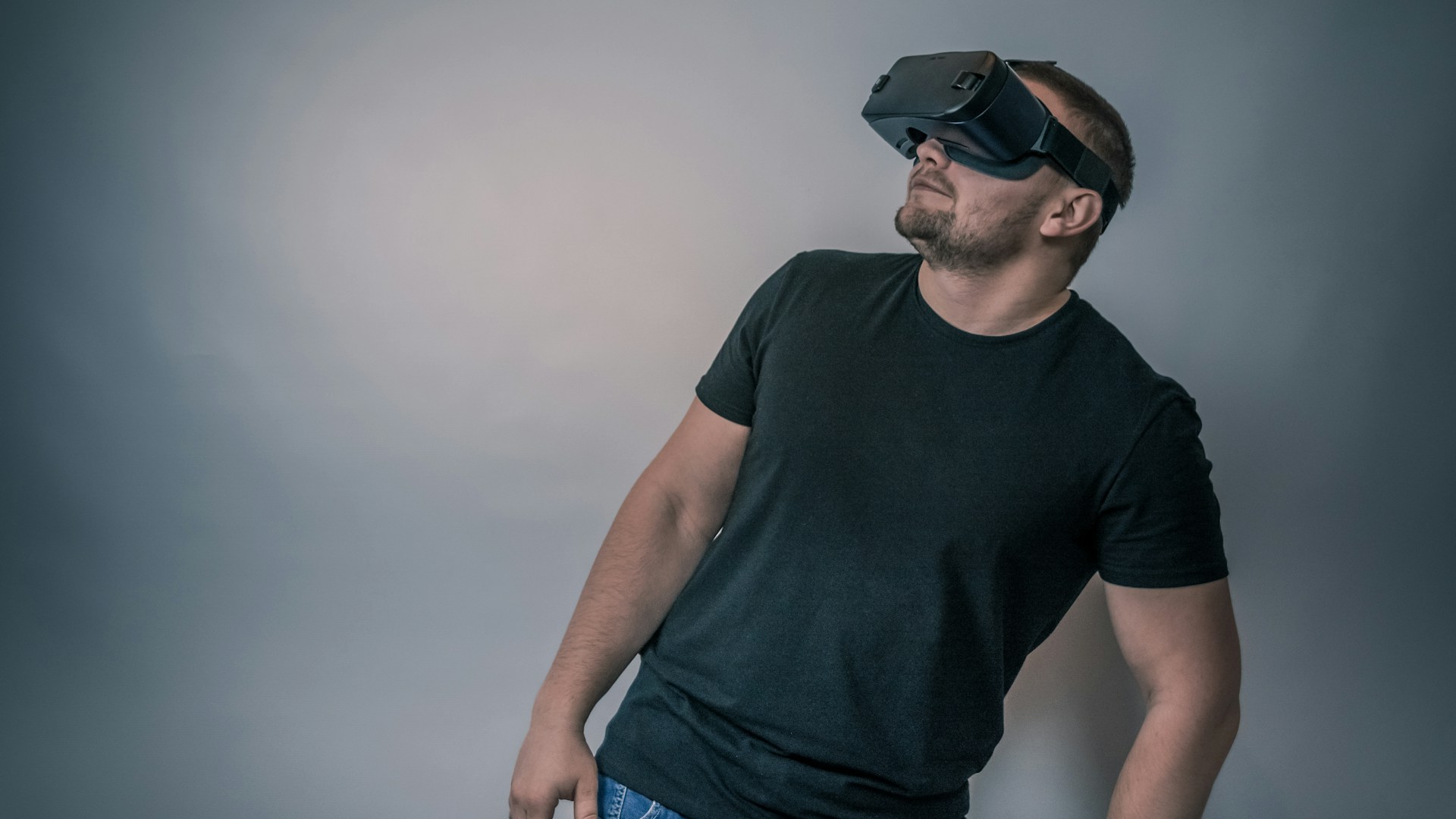 a man wearing a black t - shirt and a pair of virtual glasses